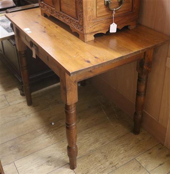 A pine kitchen table, W.102cm
